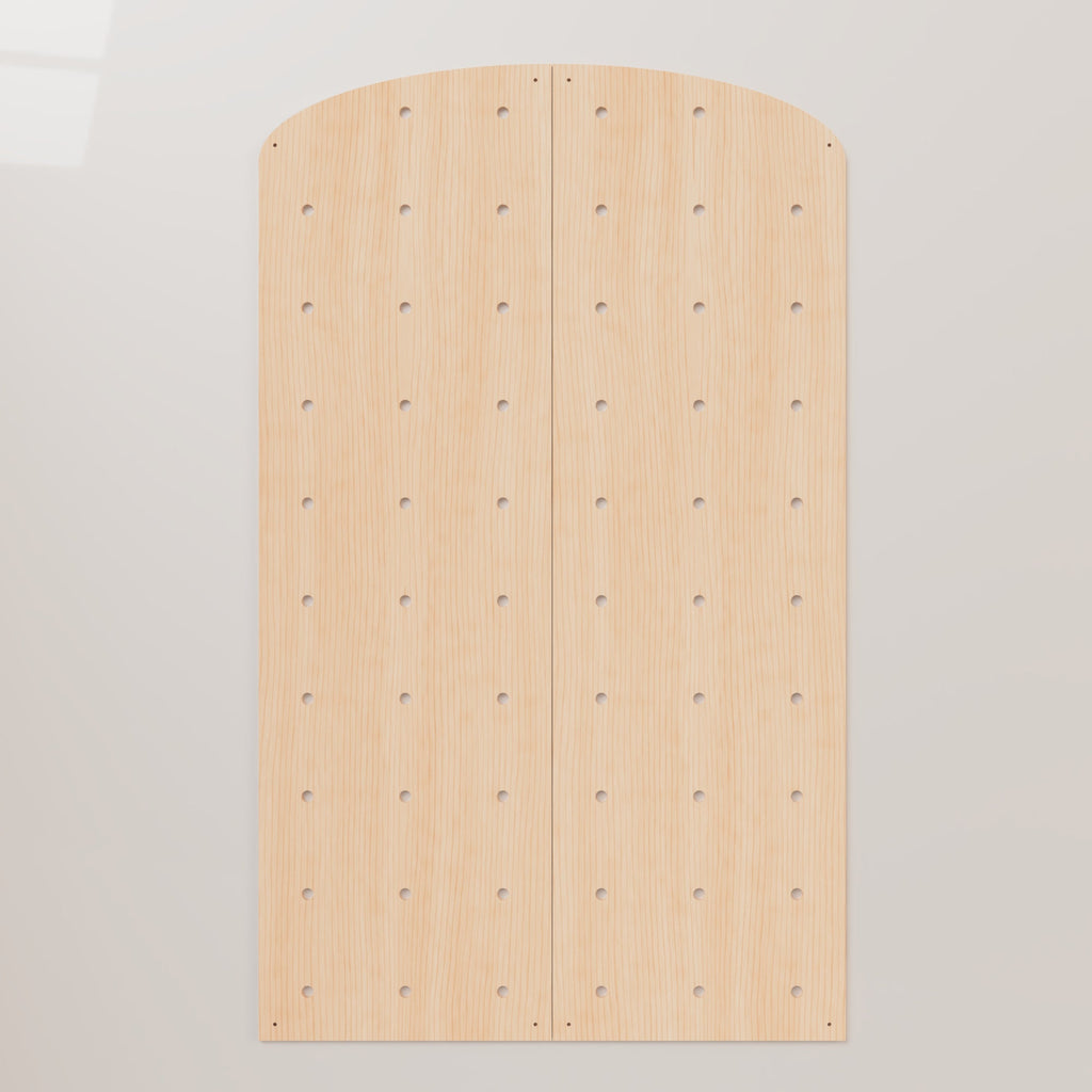 Flat-pack arched top birch plywood pegboard display panels CNC cut with peg holes, shown unassembled on gray background
