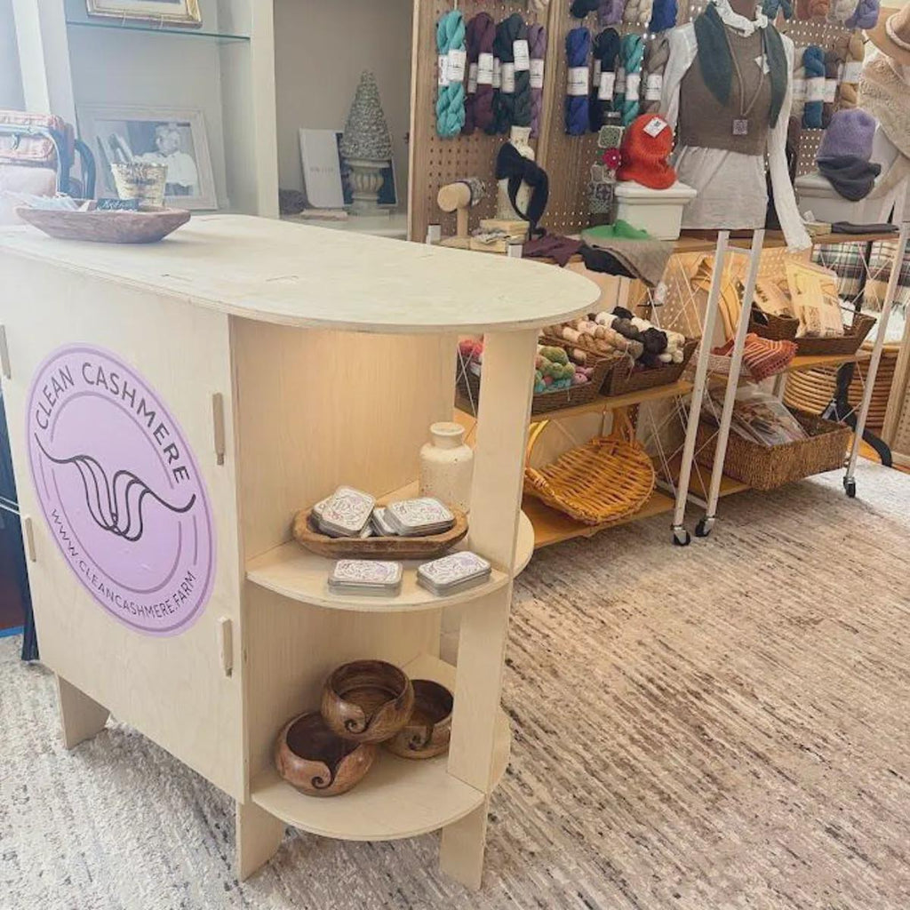 Rounded end kiosk counter with curved outer shelves, detail view, CNC cut in our shop
