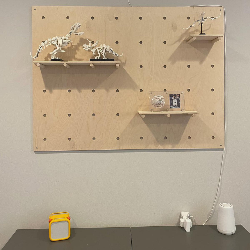 Birch plywood modular pegboard wall display, alternate styled view, CNC cut in our shop