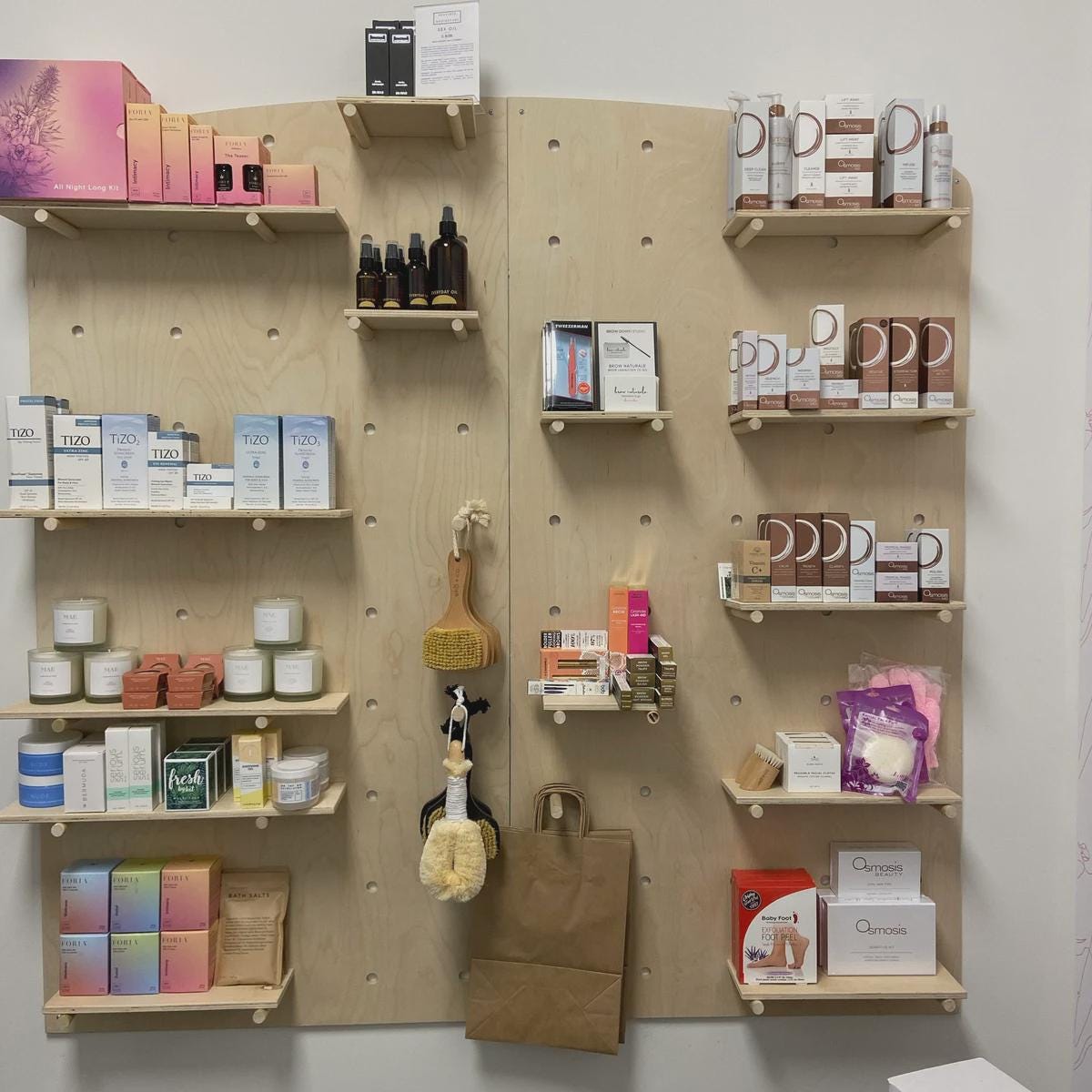 Arched top wood pegboard display with shelves and pegs, product view, CNC cut in our shop