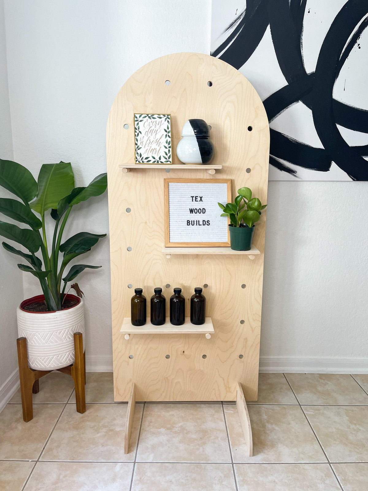 Curved pegboard retail display stand, additional styled view, CNC cut in our shop