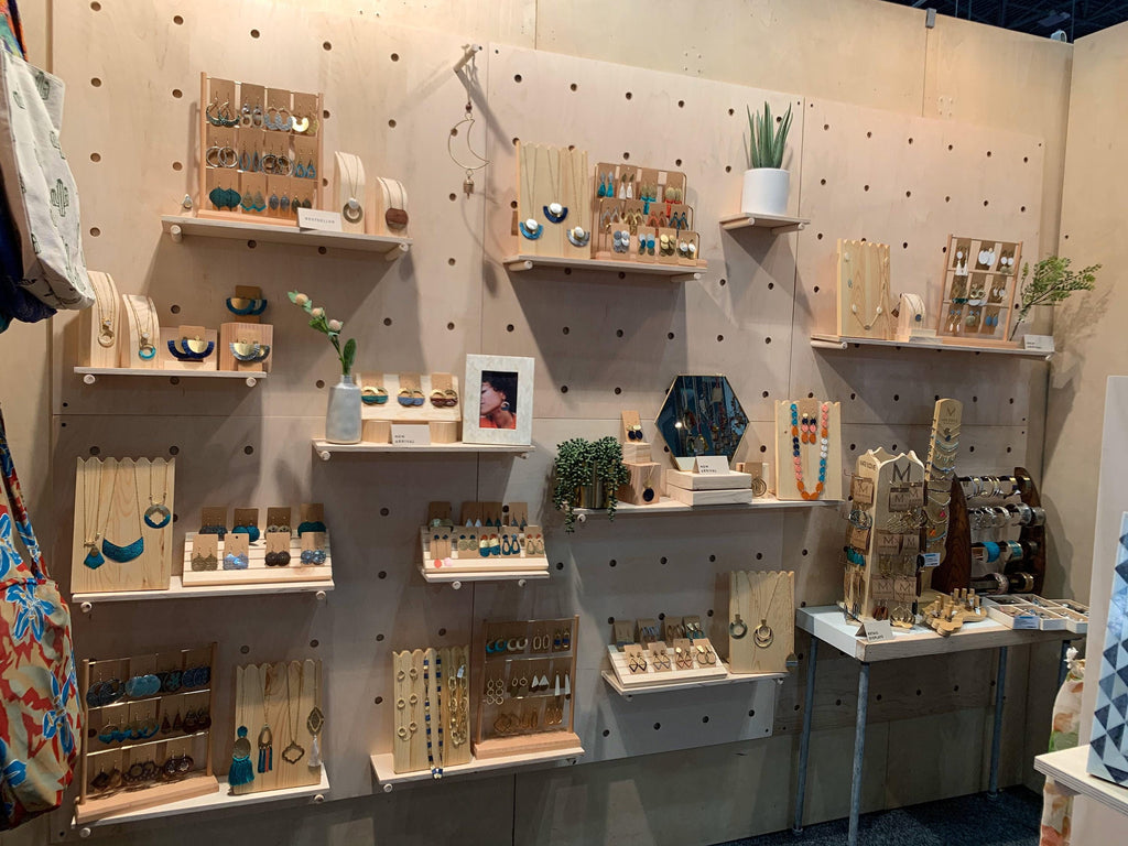 Birch plywood pegboard wall display with shelves, styled view, CNC cut in our shop