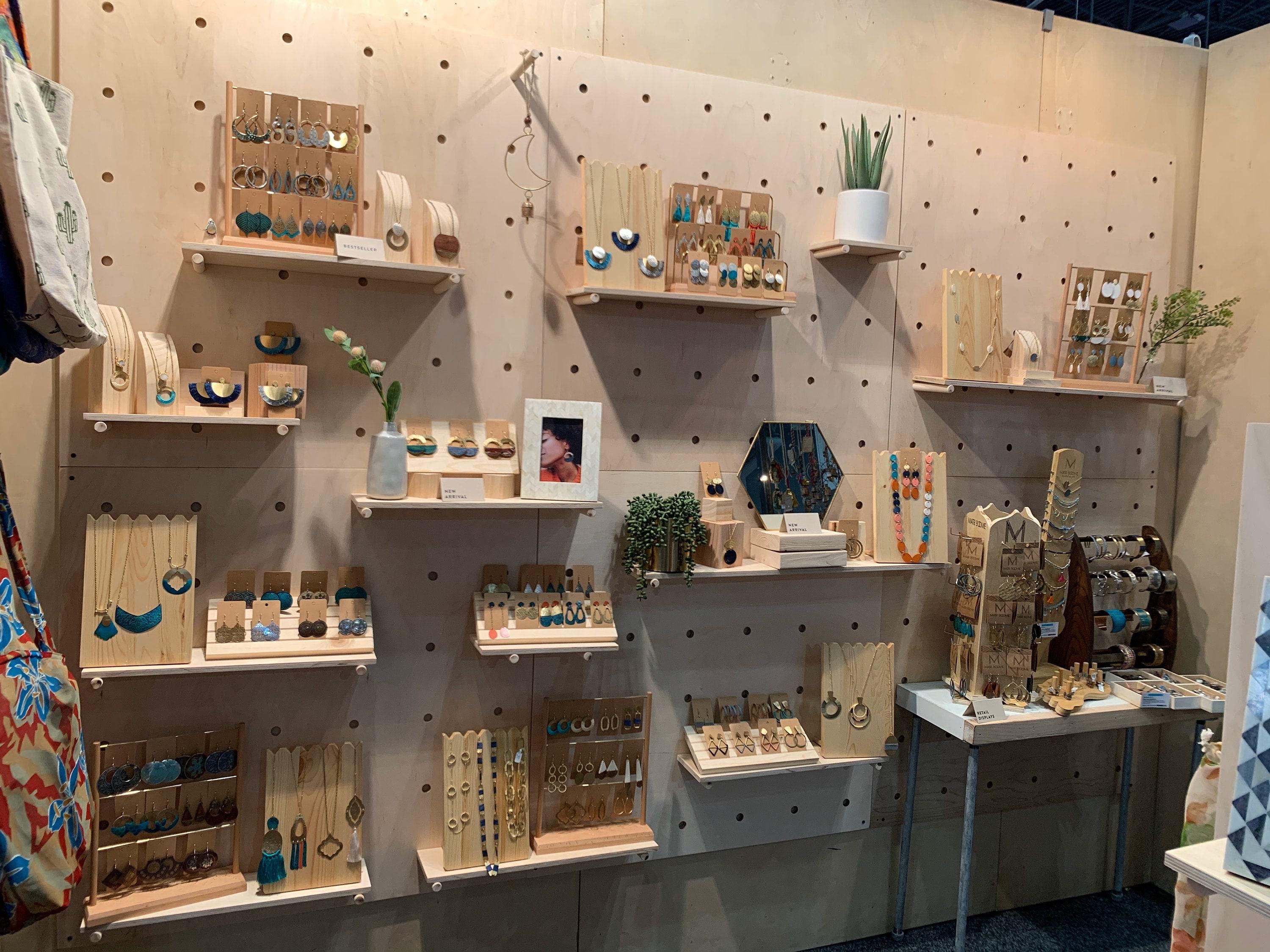 Birch plywood pegboard wall display with shelves, styled view, CNC cut in our shop